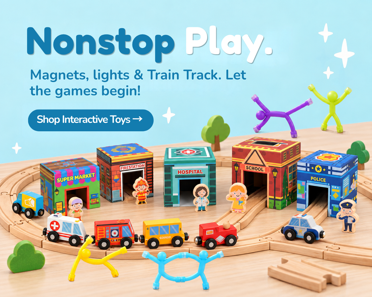 A children's wooden toy train set arranged on a curved track with colorful station buildings, small toy vehicles, and mini-doll figures on a light wood surface. Large text at the top reads 'Nonstop Play.