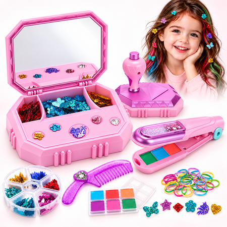 A pink children's craft and jewelry-making set displayed on a white background, including an open mirror case with sequins and gems, a hot air style tool, a comb, a small palette, a wheel of colorful rhinestones, and many colorful rubber bands. A smiling girl with multicolored hair clips appears in the top right corner.