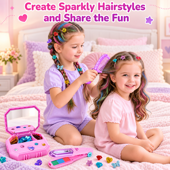 Two young girls sitting on a pink bed in a bedroom setting, playing with a toy hair styling set. One girl is wearing a purple outfit and braids her hair with colorful hair clips while the other girl in a pink outfit sits beside her.