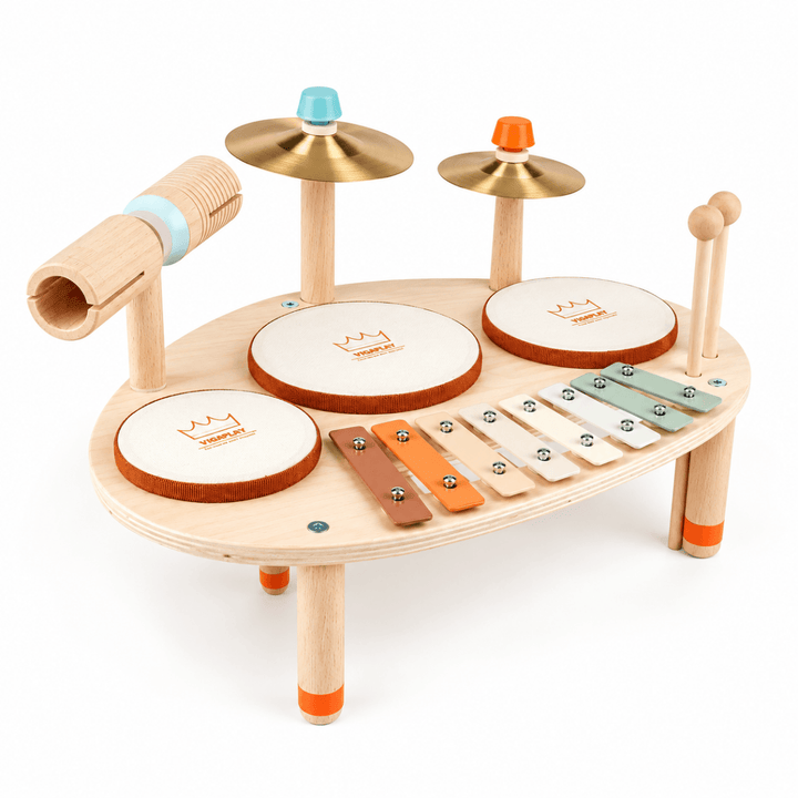A wooden toy drum set with cymbals, drum pads, a xylophone, and mallets on a white background.