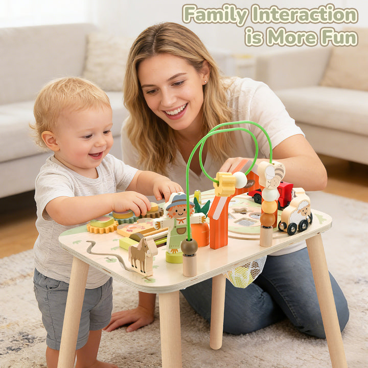 Toddler using the wooden farm activity table during indoor play