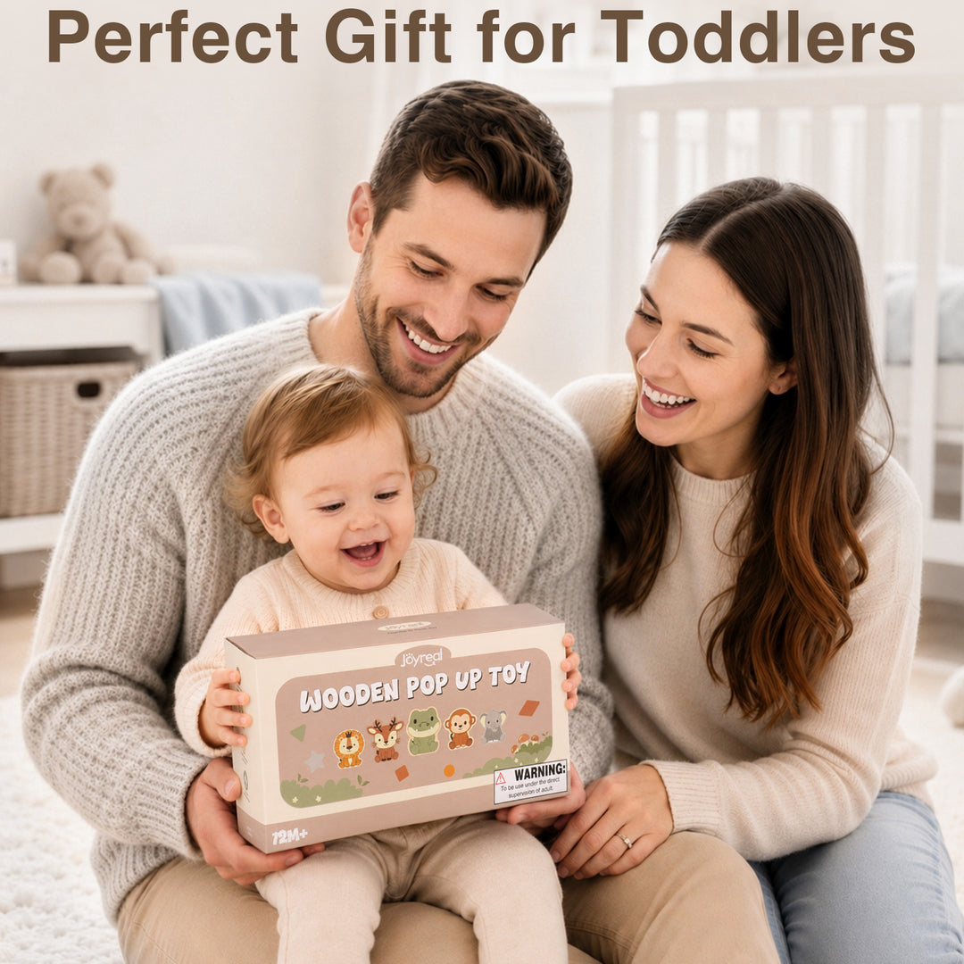 A smiling toddler sits on a man&